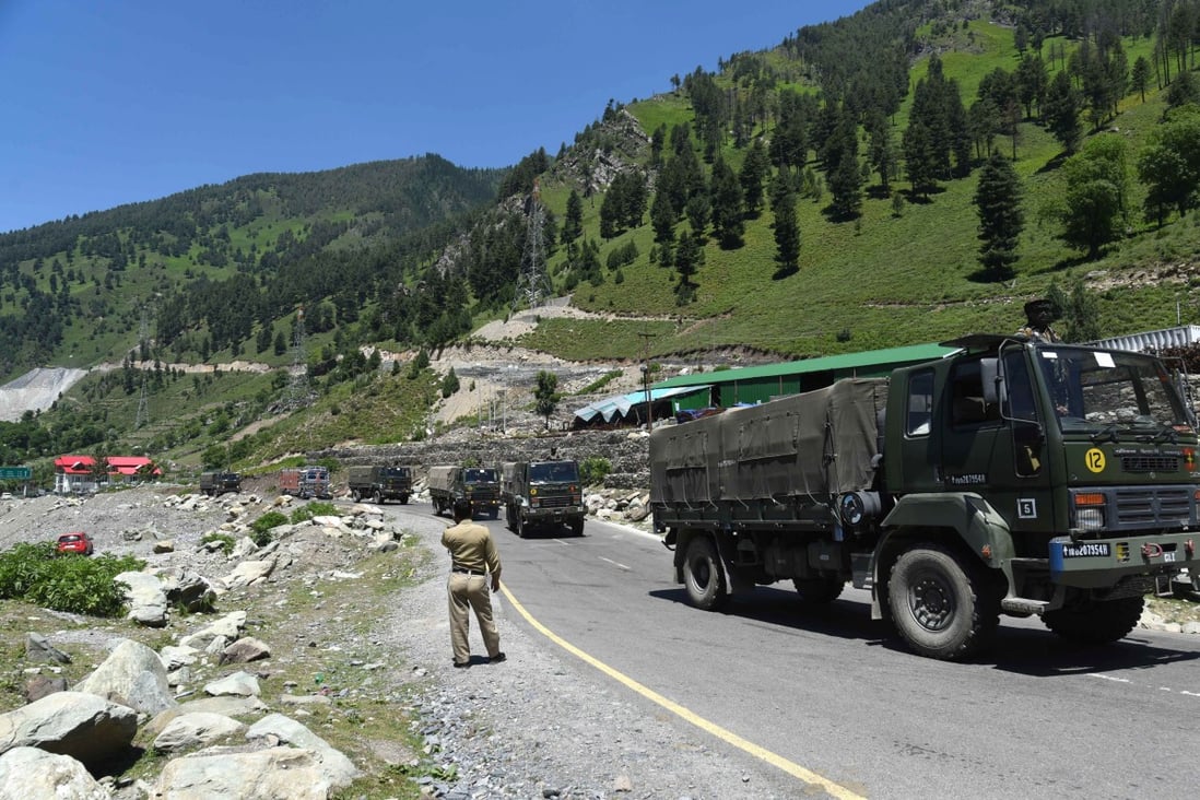 Indian army trucks travel along a highway leading to Ladakh, in Jammu and Kashmir, on Monday. Photo: EPA-EFE