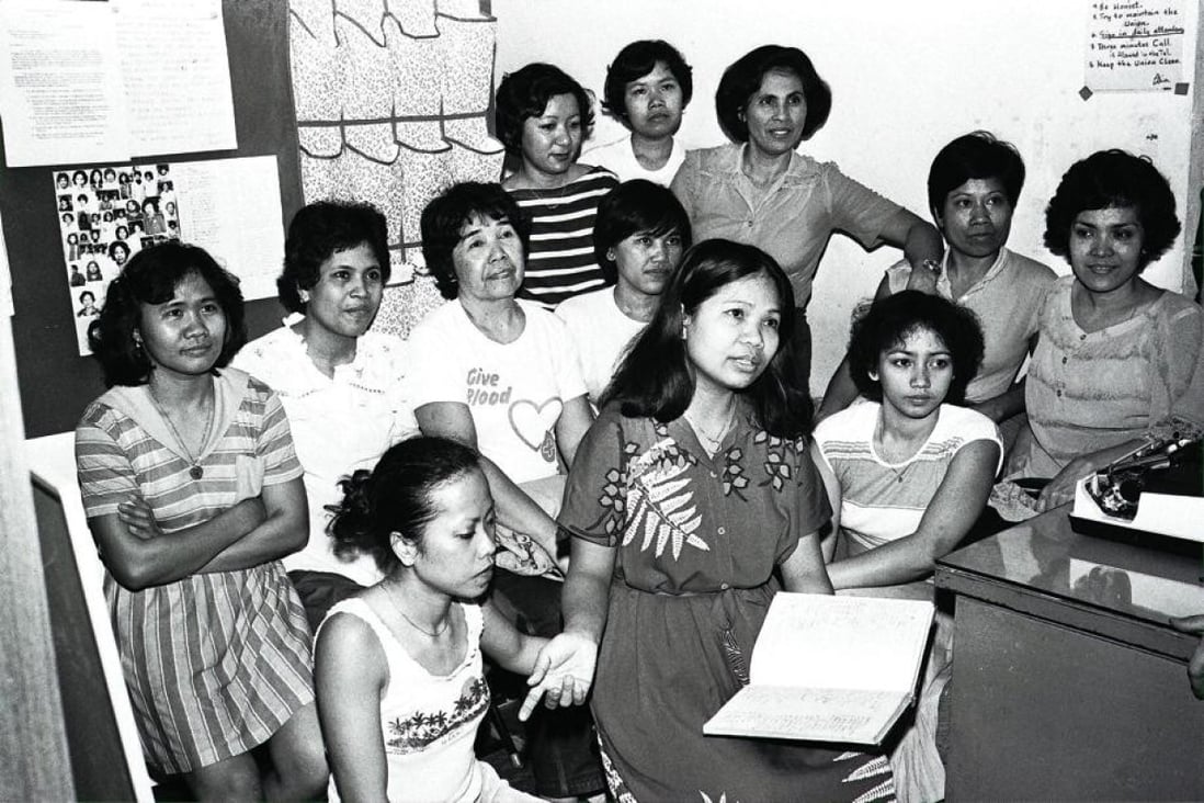 Chairwoman of the Hong Kong Domestic Workers’ Union, Gloria Futol (centre), with former maids, in 1983. Photo: SCMP
