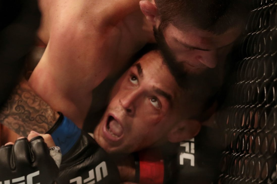 UFC lightweight champion Khabib Nurmagomedov tries to submit Dustin Poirier during their title fight at UFC 242 in Yas Island, Abu Dhabi, in September 2019. Photo: Reuters