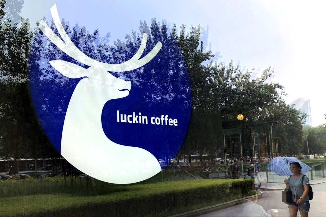 The logo of Chinese coffee chain Luckin Coffee is pictured on the window of one of its shop in Beijing. Photo: Simon Song