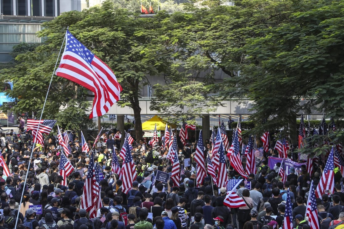 Anti-government protesters hold US flags during a Hong Kong rally last year. Photo: Winson Wong