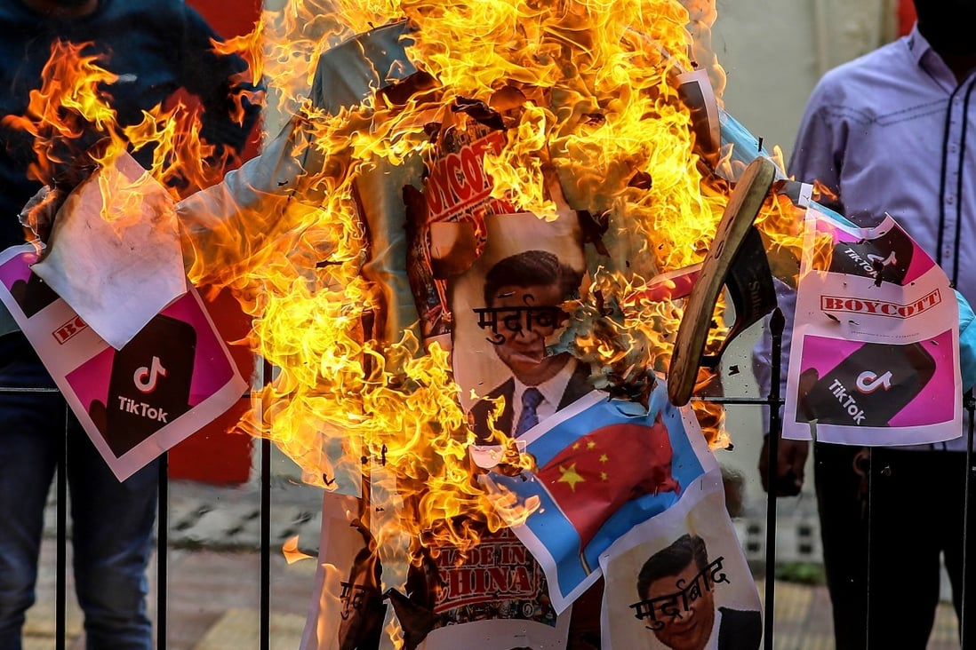 BJP members burn an effigy of Xi Jinping during a protest against China in Mumbai on June 19. China’s reputation among Indians had been battered by the border dispute. Photo: EPA-EFE