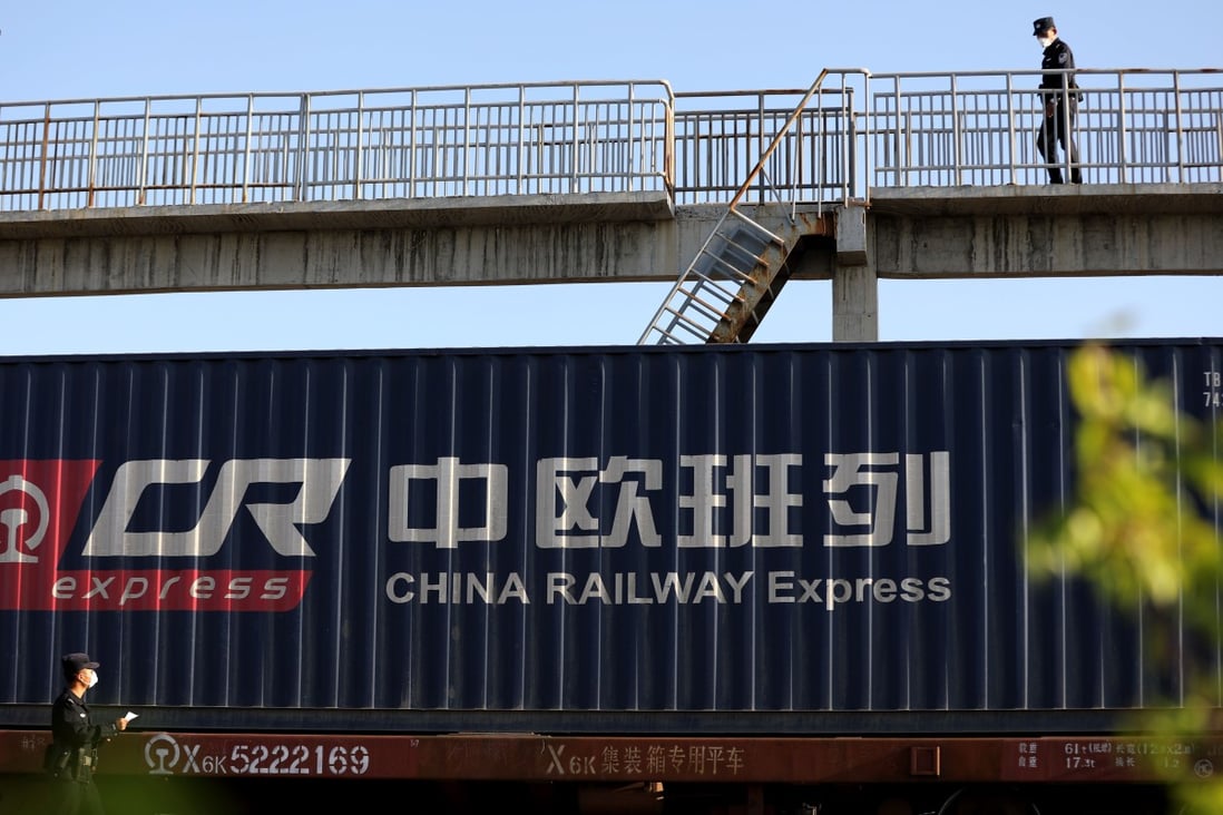 A police officer checks an outbound China-Europe freight train at Khorgos Pass in northwest China's Xinjiang Uygur Autonomous Region. Photo: Xinhua
