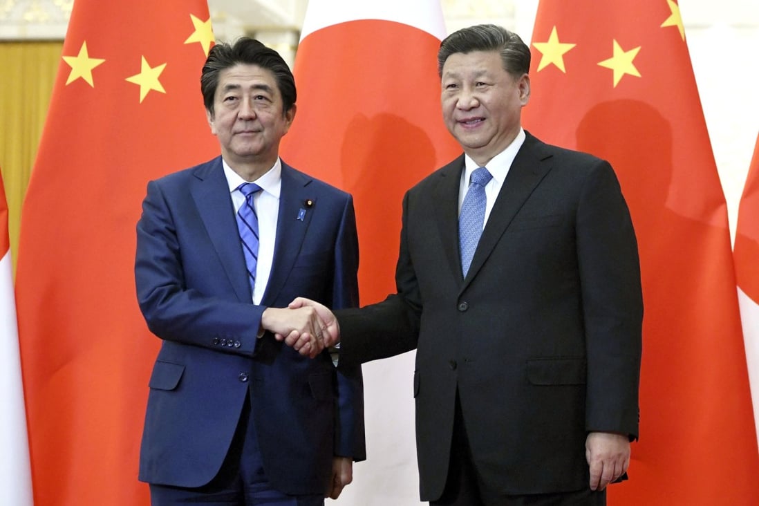 Japan's Prime Minister Shinzo Abe (left) and China's President Xi Jinping at their last meeting in December. Photo: AP