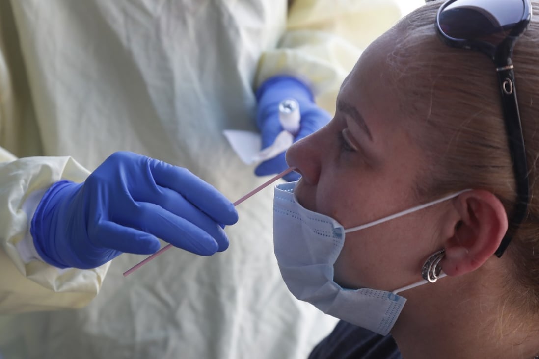 A woman is tested for coronavirus at a mobile Covid-19 testing unit in Massachusetts. Photo: AP Photo