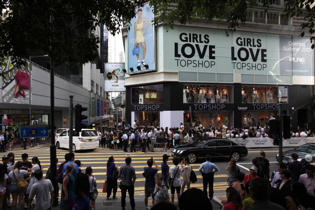 Crowds gather outside Topshop’s flagship store in Central, during its opening ceremony in Hong Kong on June 6, 2013. Photo: Reuters