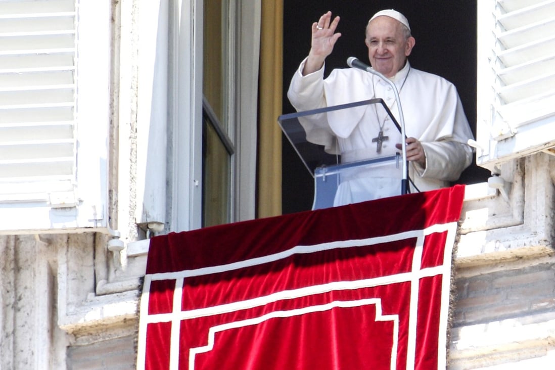 Pope Francis waves from his window overlooking St Peter's Square at the end of the Angelus prayer on Sunday. Photo: AP