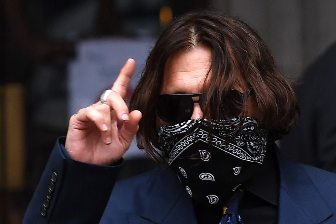 US actor Johnny Depp gestures as he arrives at court in London on Thursday. Photo: EPA-EFE