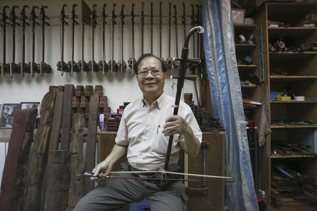 Tong Man-hak with one of his handmade erhus in his workshop in Tai Kok Tsui, Hong Kong. Photo: Jonathan Wong