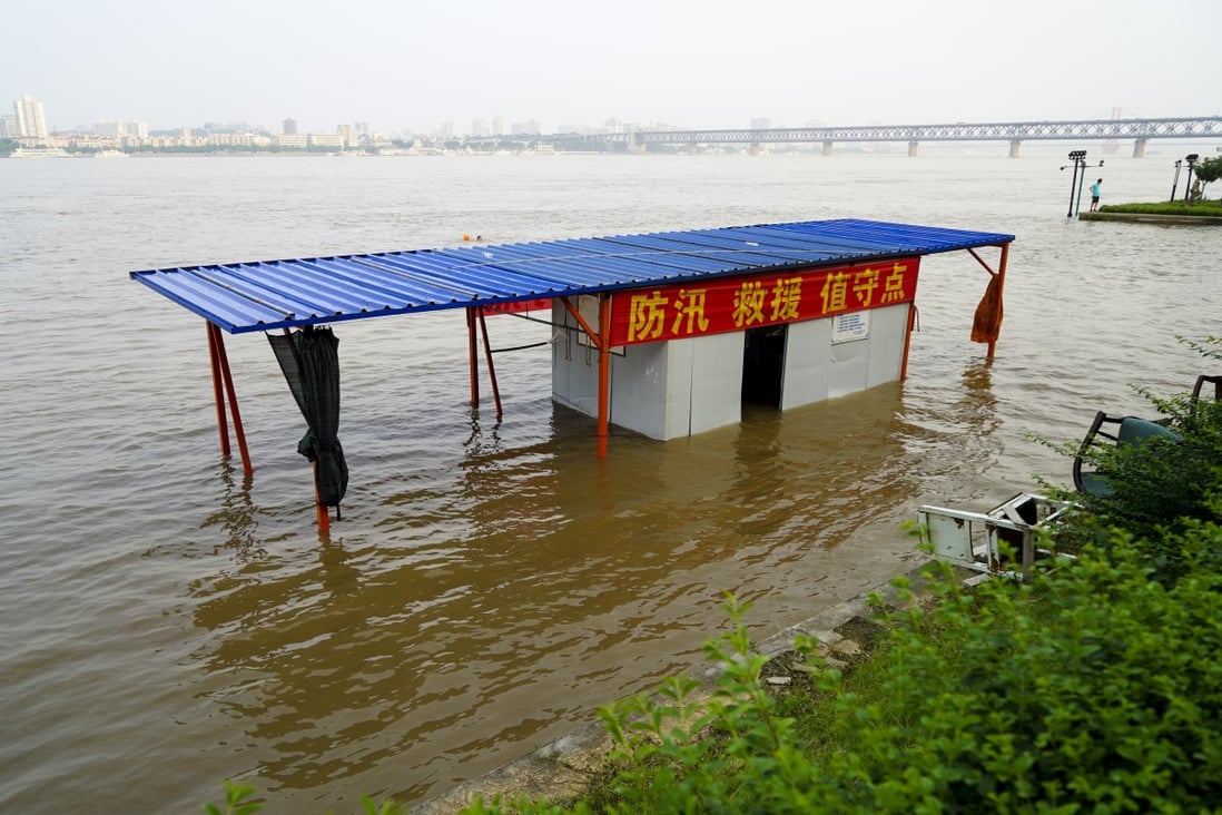 A flood warning station in Wuhan is partially submerged by the Yangtze River. Photo: Tom Wang