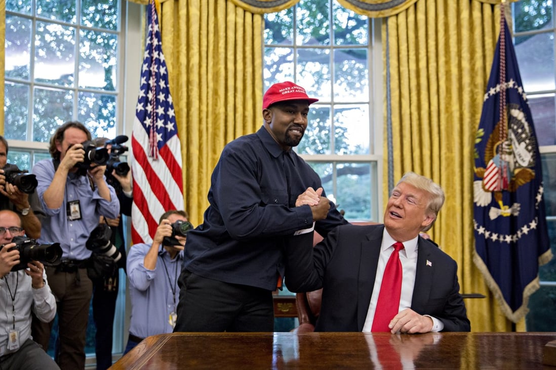 Rapper Kanye West (left) shakes hands with US President Donald Trump during a meeting in the Oval Office of the White House in Washington on October 11, 2018. Photo: Bloomberg