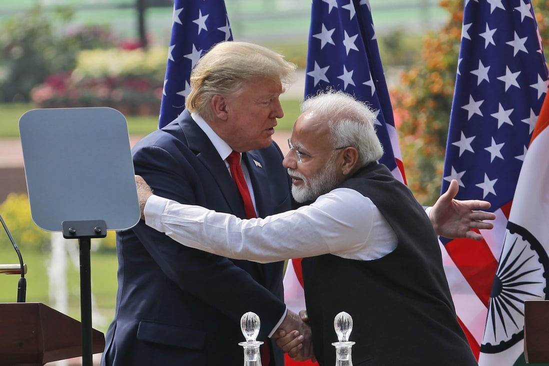 US President Donald Trump and Indian Prime Minister Narendra Modi embrace after giving a joint statement in New Delhi on February 25. Photo: AP