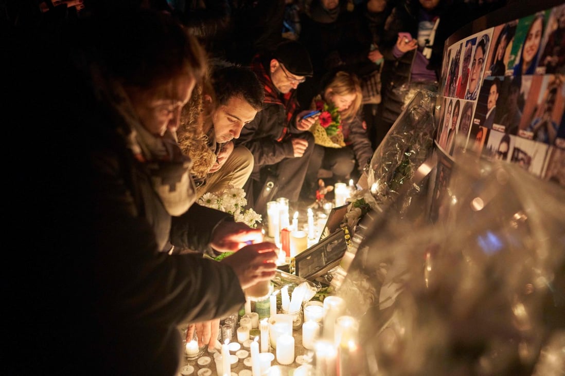 Mourners light candles for the victims of Ukrainian Airlines flight 752 during a vigil at Mel Lastman Square in Toronto, Canada, in January – 55 Canadian citizens were among the dead. Photo: AFP