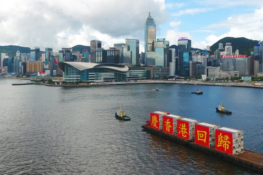 A barge bearing the slogan of “Celebrating the 23rd anniversary of Hong Kong’s return to the motherland” sails through Victoria Harbour in Hong Kong on July 1. Photo: Xinhua
