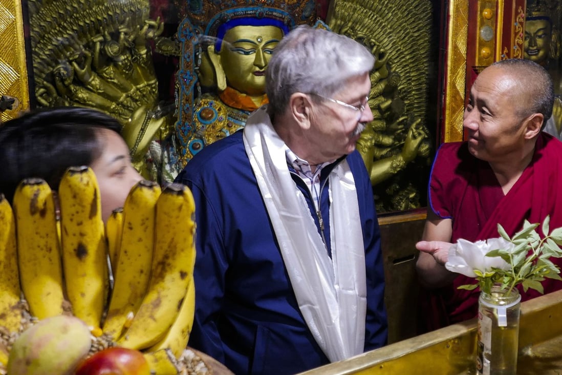 US Ambassador to China Terry Branstad speaks with a monk at the Jokhang Temple in Lhasa in the Tibet Autonomous Region in May 2019. Photo: US Mission to China via AP
