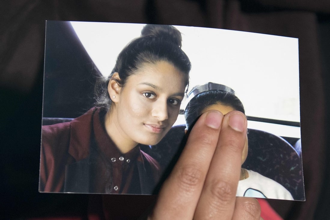 A photo of Shamima Begum is held by her sister during an interview in London in February 2015. Photo: AFP