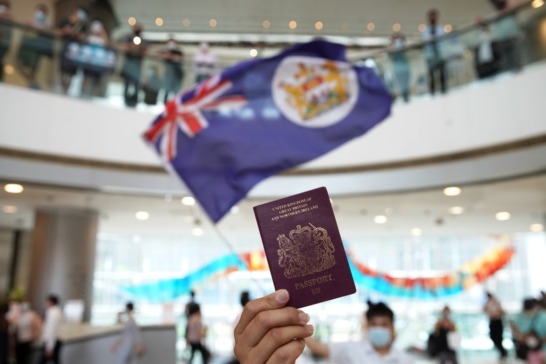 A protester holds a BN(O) passport during a protest at IFC Mall on May 29. Photo: Winson Wong