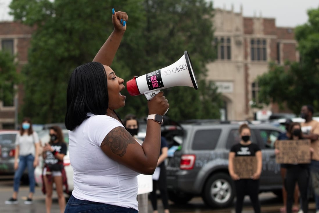Educator Victoria Clark protests outside the Oakland County Circuit Court and Prosecutors Office in Pontiac, Michigan, on Thursday. Photo: Reuters