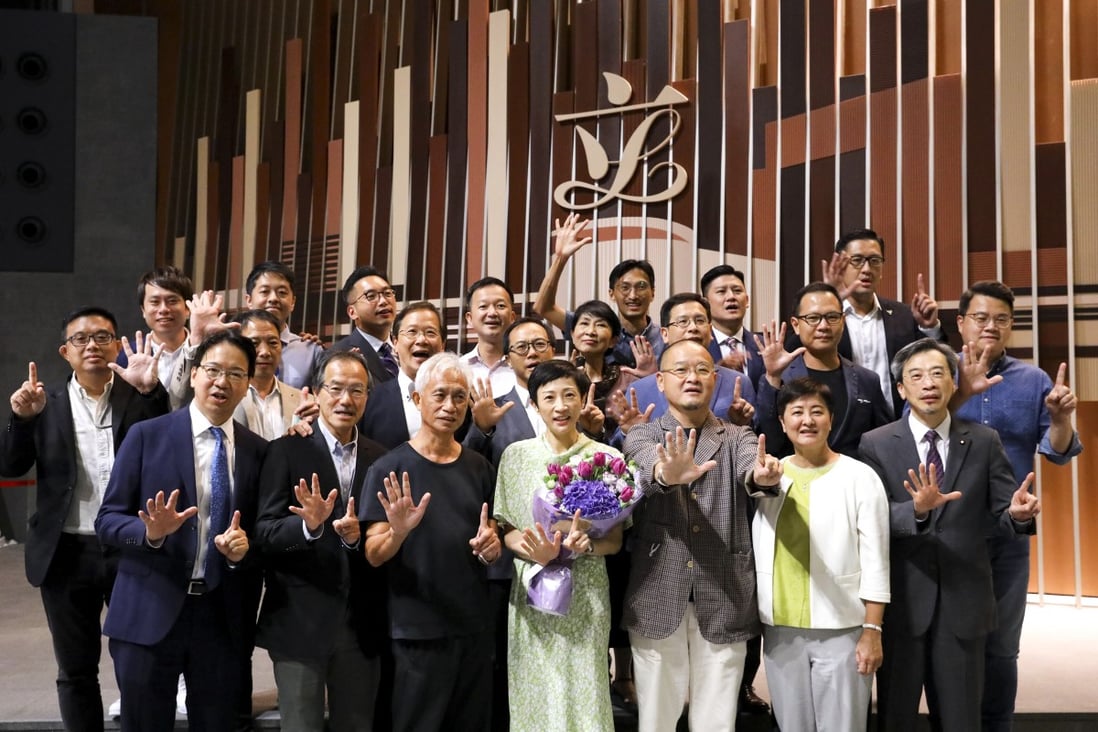 Opposition lawmakers pose for a group photo to mark the end of the Legislative Council term, holding out their hands to signal the ‘five demands, not one less’ rallying call of the protest movement. Photo: Dickson Lee