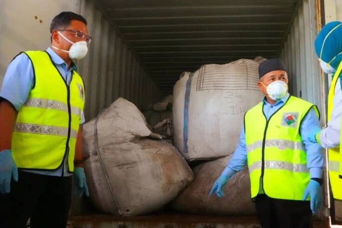Malaysia’s Environment and Water Minister Tuan Ibrahim Tuan Man points to a container containing electric arc furnace dust, a by-product of steel production that contains heavy metals like zinc, cadmium and lead. Photo: Twitter