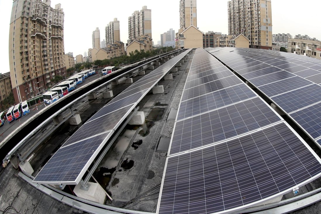 Solar panels at a solar-powered bus station in Shanghai in December 2016. China has more renewable energy capacity than any other country in the world. Photo: Xinhua