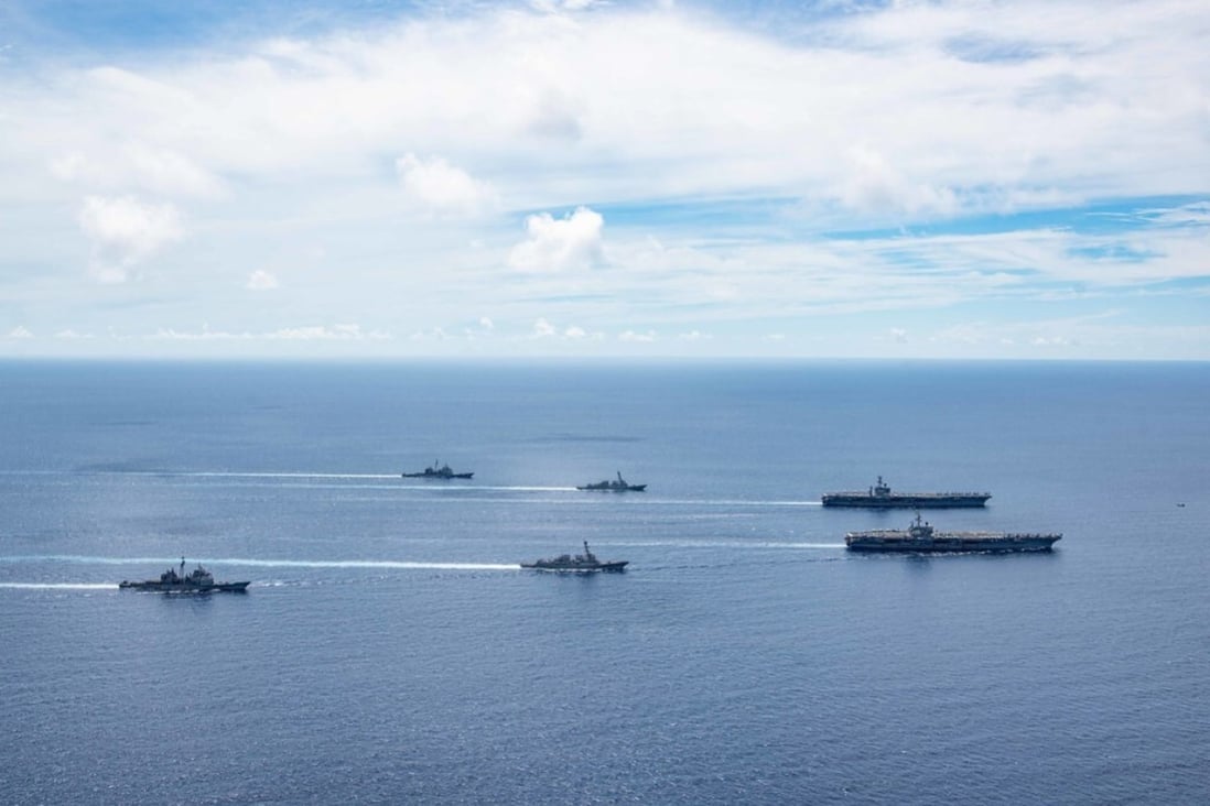 In this file photo, the Ronald Reagan and Nimitz Carrier Strike Groups steam in formation in the South China Sea, July 6. (U.S. Navy/MC3 Jason Tarleton)