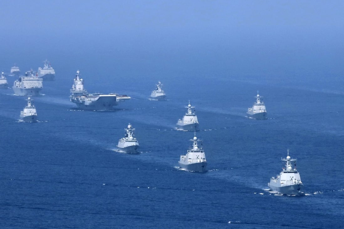 China’s Liaoning aircraft carrier is accompanied by navy frigates and submarines during exercises in the South China Sea. Photo: AP