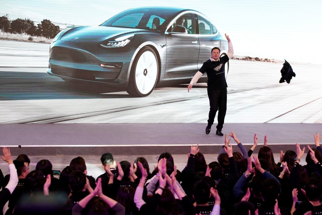 Tesla’s chief executive officer Elon Musk throwing off his coat for a jig onstage during a delivery of Tesla’s China-made Model 3 cars in Shanghai on January 7, 2020. Photo: REUTERS
