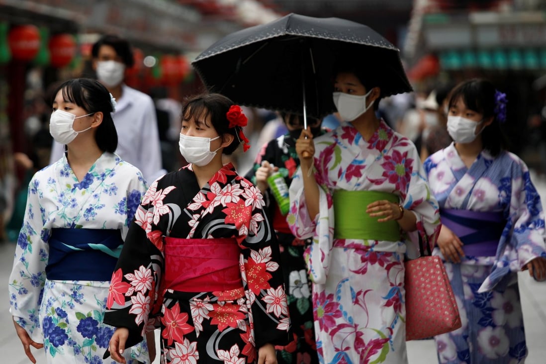 Women in yukata walk along Nakamise Street at Asakusa district, a popular sightseeing spot in Tokyo. Photo: Reuters