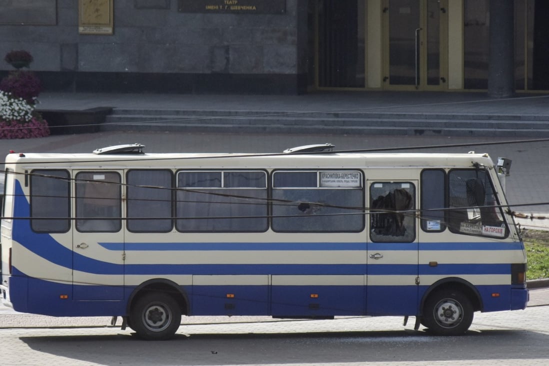 A bus containing hostages is seen after an armed man seized the vehicle and took passengers hostage in the Ukrainian city of Lutsk. Photo: AP
