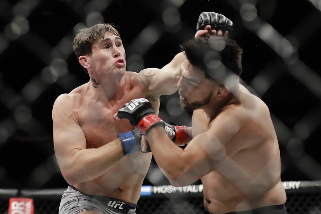 Darren Till punches Kelvin Gastelum during the second round of their middleweight bout at UFC 244. Photo: AP