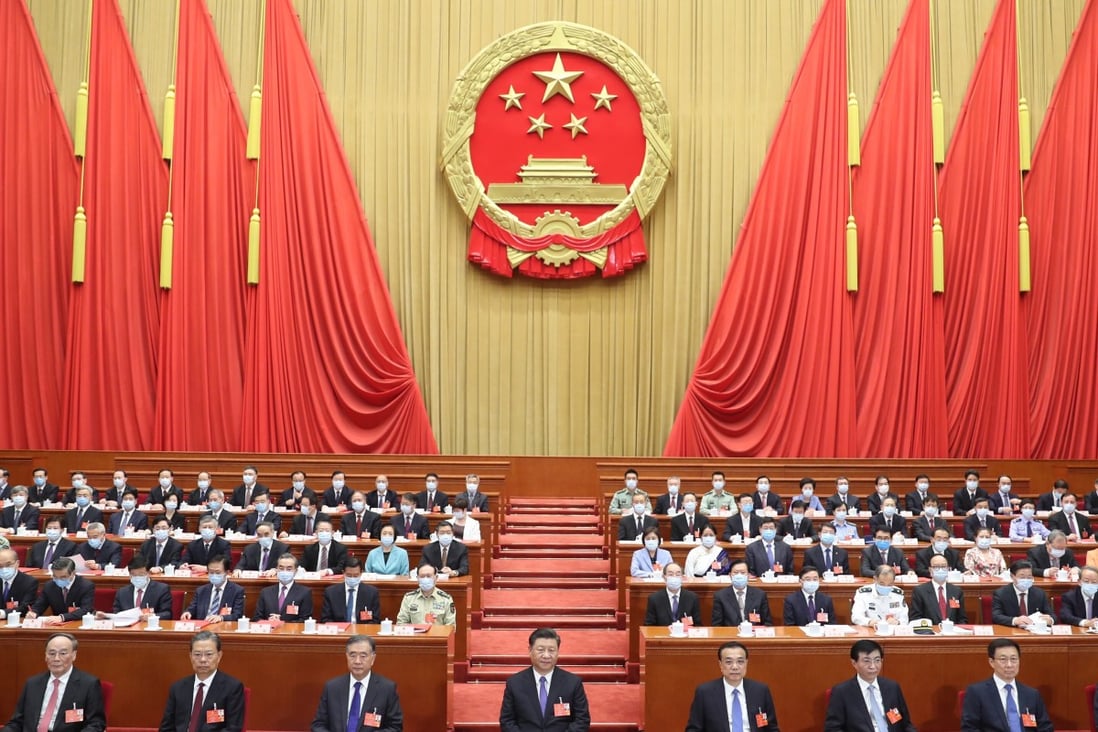 Communist Party leaders hold the closing meeting of the third session of the 13th National People’s Congress, at the Great Hall of the People in Beijing on May 28. Attempts to drive a wedge between the Communist Party and the Chinese people are doomed to failure because the Communist Party is the Chinese people. Photo: Xinhua