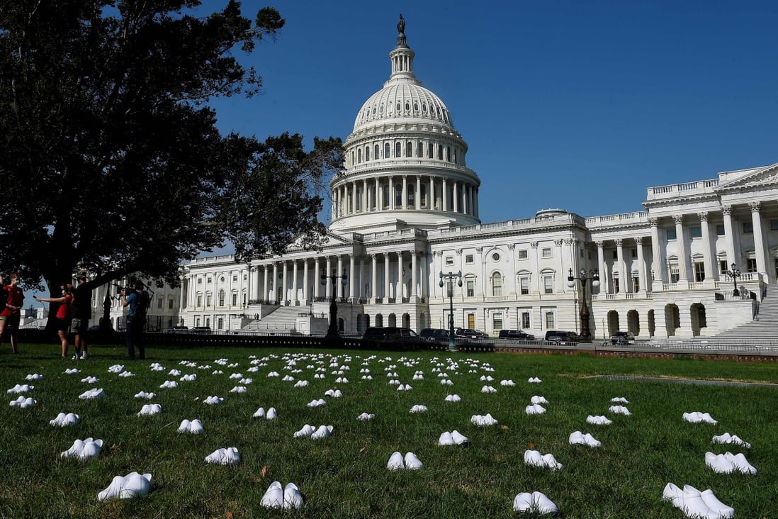 A display of 164 pairs of white clogs arranged outside the US Capitol building by National Nurses United to honour the more than 160 nurses who have lost their lives from Covid-19 in the United States. Photo: AFP
