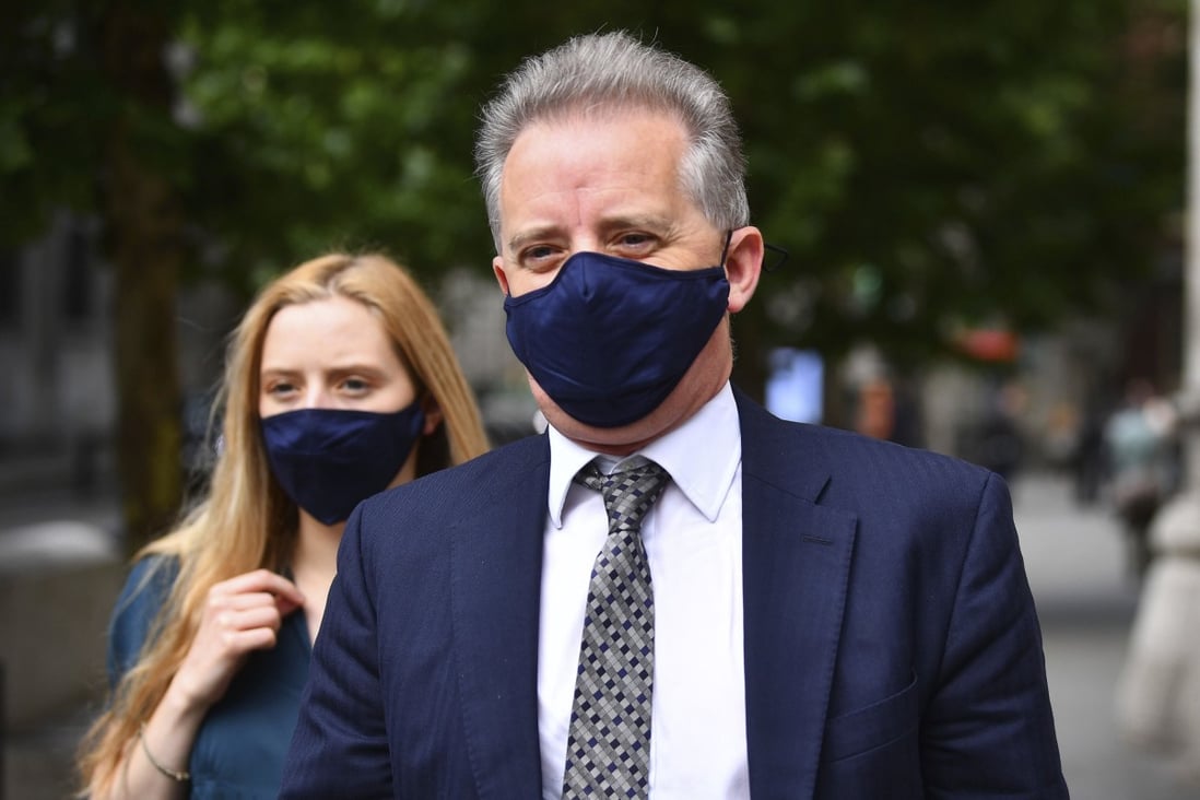 Former British spy Christopher Steele leaves the High Court in London after a hearing on Wednesday. Photo: PA via AP