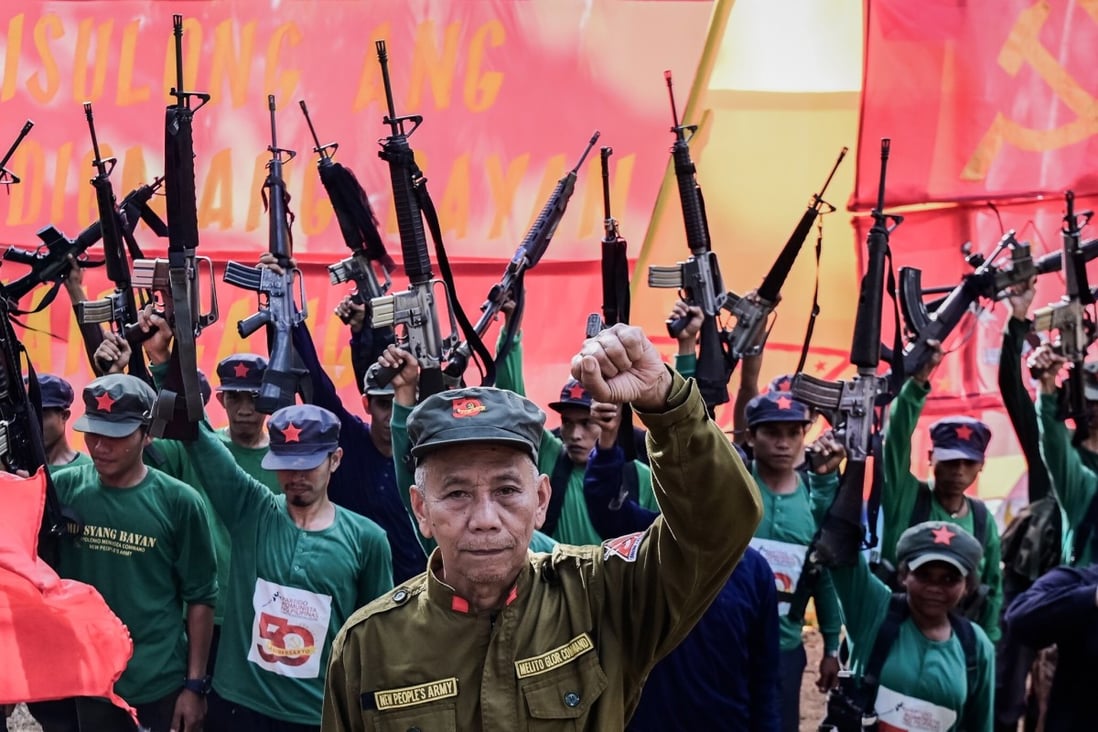 Jaime Padilla, a spokesman for the CPP-NPA, with his comrades in March 2019 at the 50th anniversary of the movement taking up arms in the Philippines. Photo: EPA