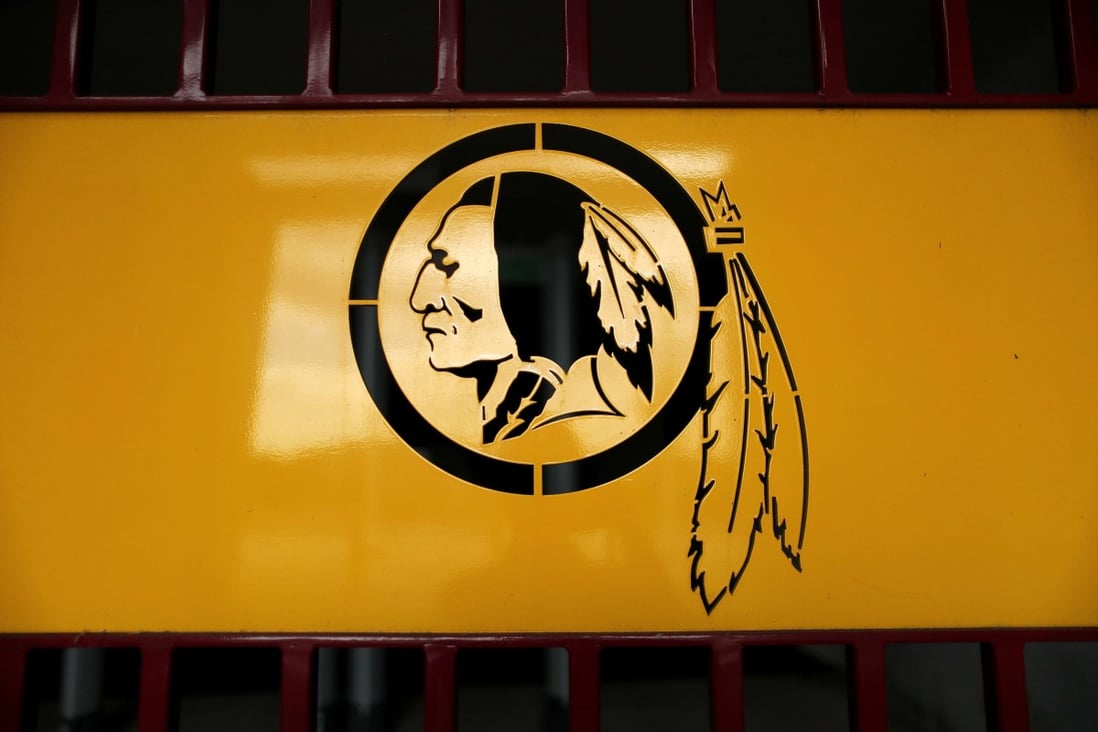 The NFL’s Washington Football Team’s former Redskins logo is stamped in a steel gate at FedEx Field. Photo: AFP