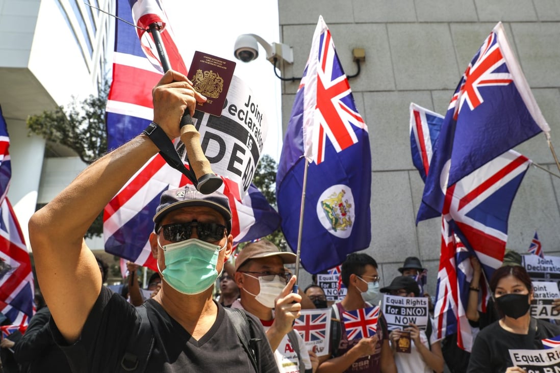 Anti-government protesters in Hong Kong hold BN(O) passports aloft during a rally at the British Consulate last October. Photo: Nora Tam