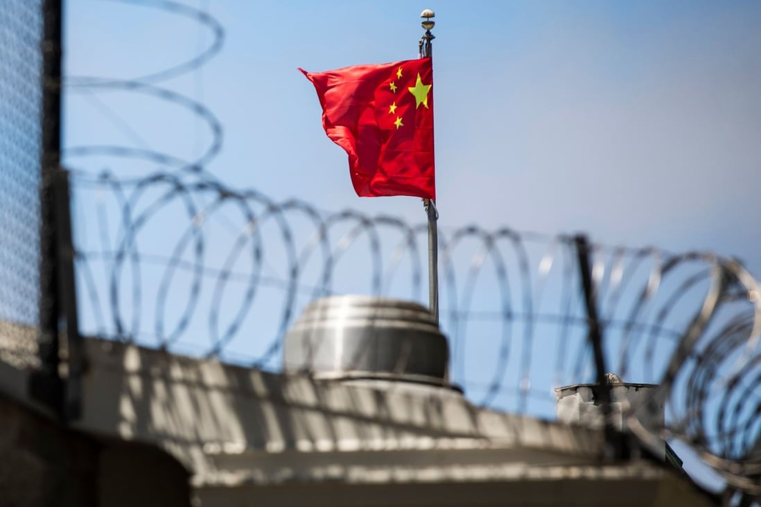 The Chinese flag flies behind barbed wire at the Chinese Consulate General in San Francisco. Photo: AFP