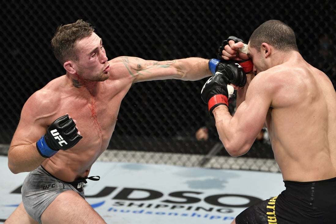 Darren Till punches Robert Whittaker in their middleweight bout during the UFC Fight Night event inside Flash Forum on UFC Fight Island. Photo: Jeff Bottari/Zuffa LLC via USA TODAY Sports