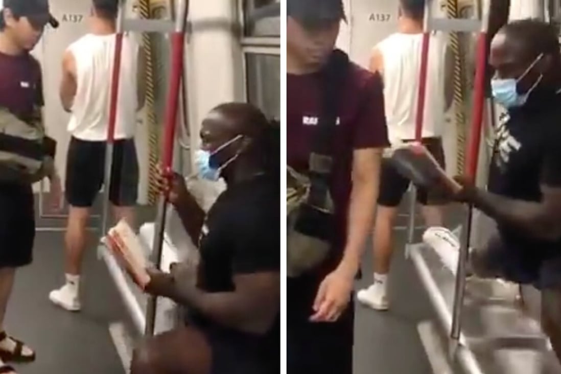ONE Championship star Alain Ngalani prevents an unmasked passenger on Hong Kong's MTR system from sitting down. Photo: Instagram/Alain Ngalani