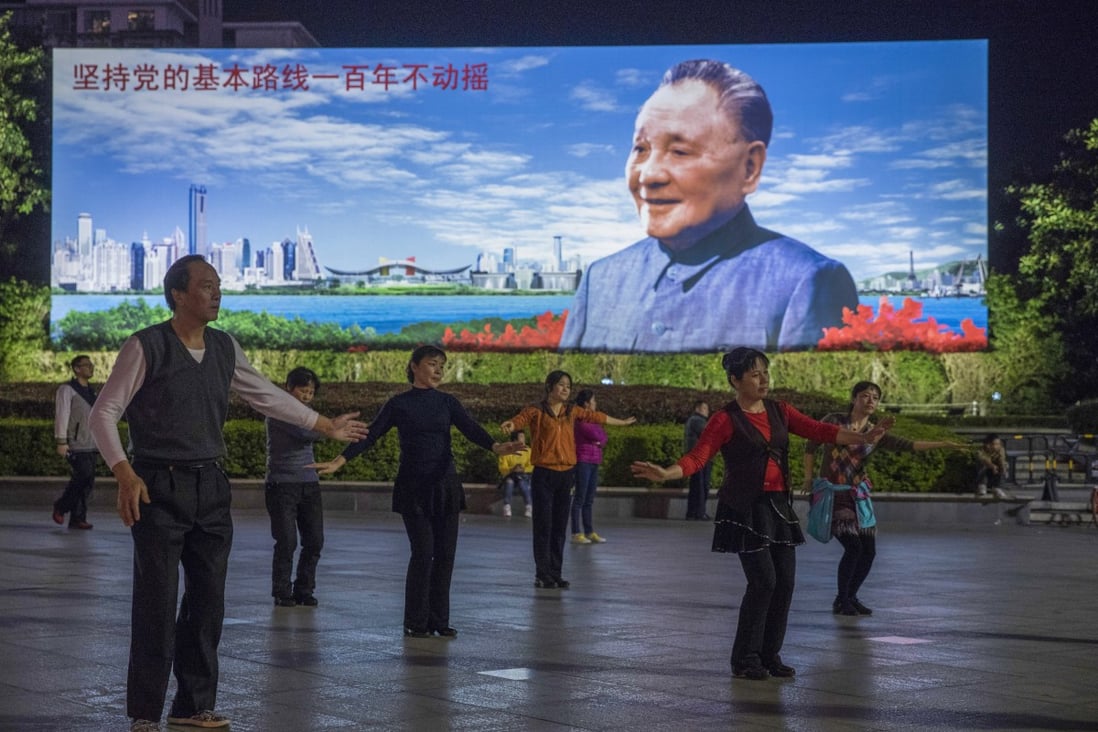 People exercise in front of a portrait of China’s former paramount leader, Deng Xiaoping, at a square in Futian district, Shenzhen – the city he designated as the nation’s first special economic zone 40 years ago. Photo: Sam Tsang