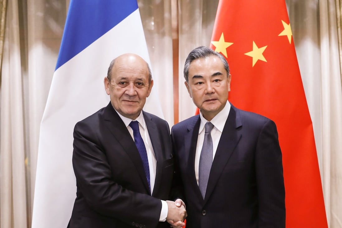 Chinese Foreign Minister Wang Yi meets his French counterpart Jean-Yves Le Drian in Beijing last year. Wang on Tuesday implored France and other countries not to side with the US as relations with Washington grow increasingly hostile. Photo: Xinhua