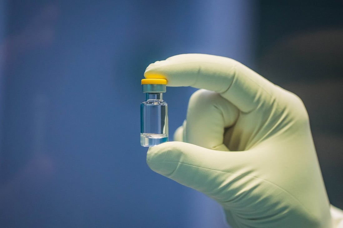 A researcher holds an individual dose of a coronavirus vaccine. The World Health Organisation says about 160 vaccines are in development, including India’s Covaxin. Photo: Reuters