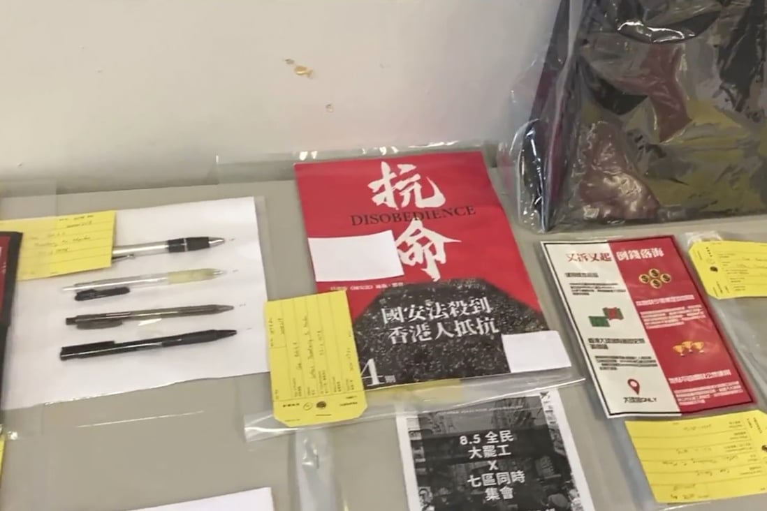 Evidence collected at the home of a 16-year-old schoolboy and his parents is displayed following their Wednesday arrest for allegedly sending a threatening letter to Hong Kong police. Photo: Hong Kong Police