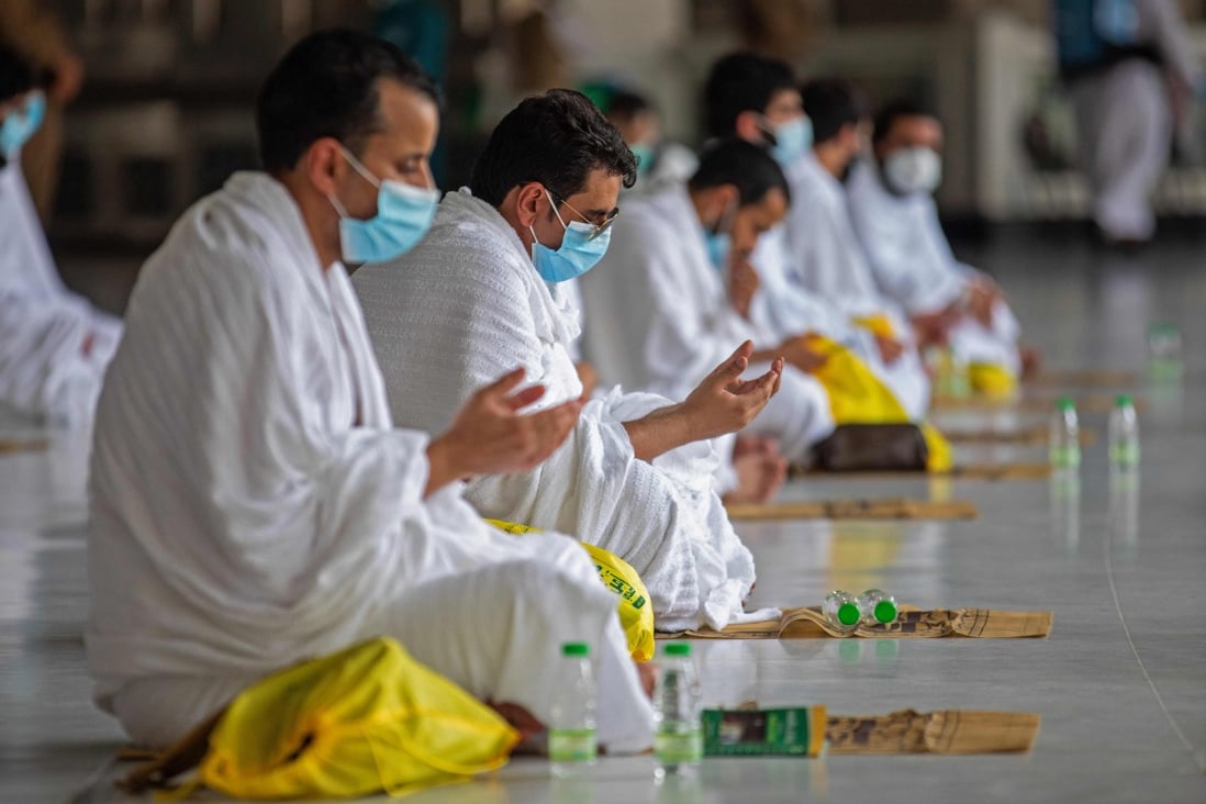 Muslim pilgrims wearing protective masks in Mecca’s Grand Mosque. Photo: AFP