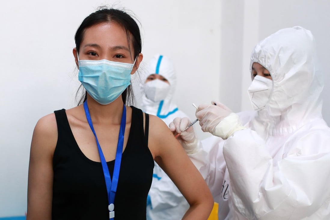 A woman takes part in a Covid-19 vaccine trial in the central China city of Wuhan in April. Photo: dpa