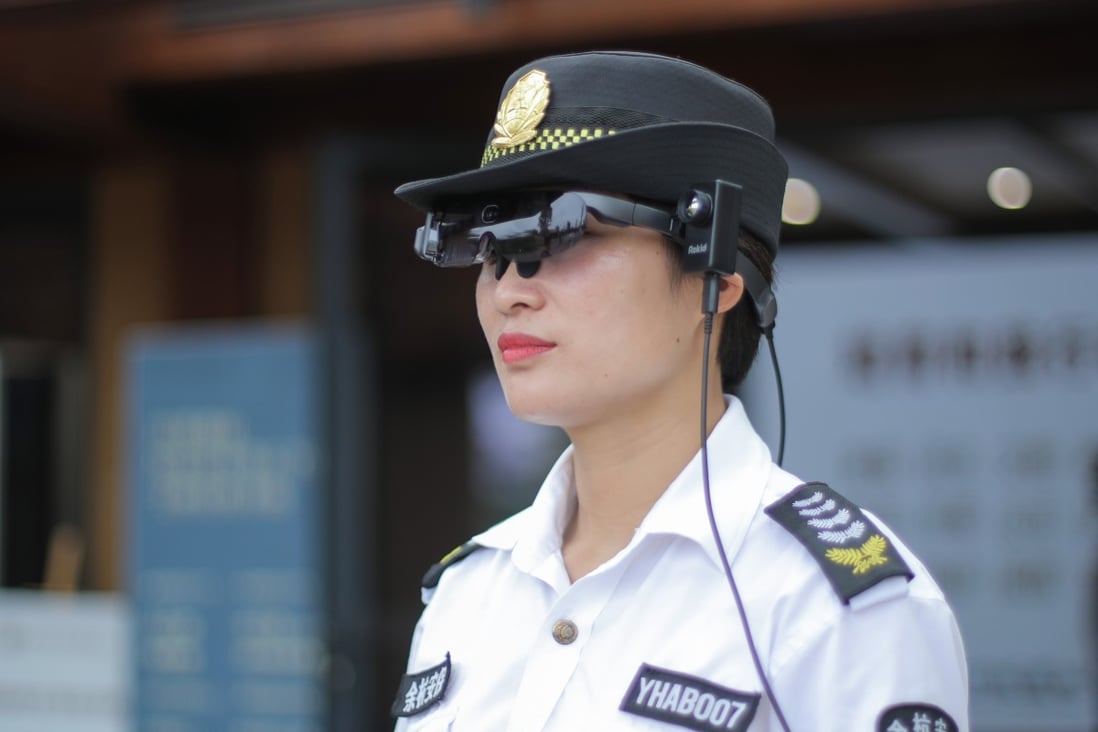 A security staff member at Liangzhu Museum in Hangzhou, eastern China, wears a pair of Rokid smart glasses to check the temperature of visitors. Photo: Handout