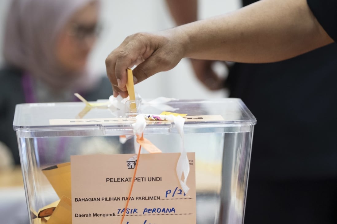 While changes to Malaysia’s voting age were approved by parliament, the effective start date has not been gazetted. Photo: AP