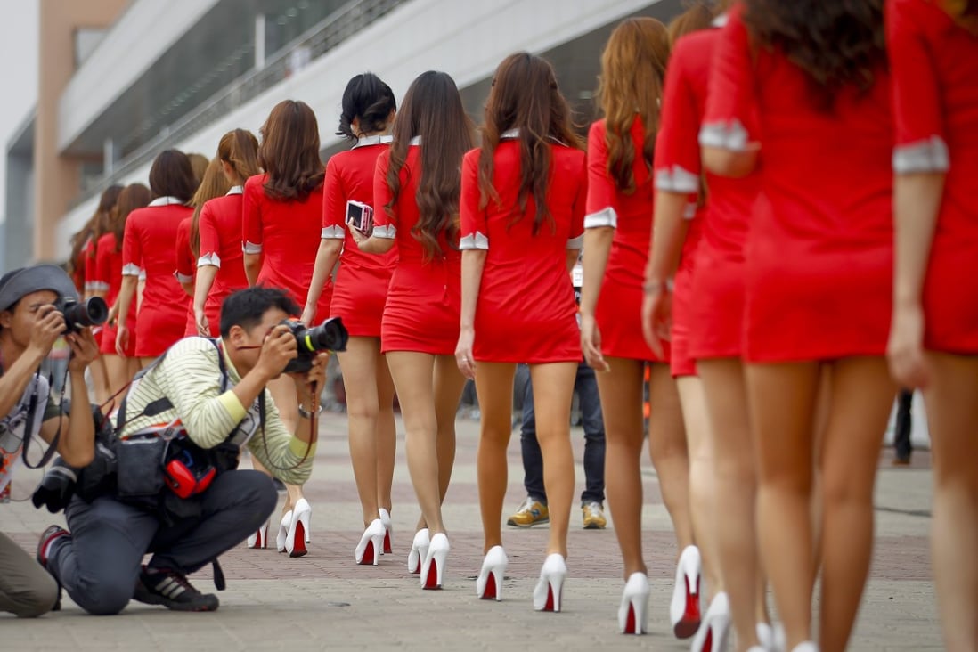 Women wearing miniskirts are seen at the South Korea Formula One Grand Prix in 2012. The government says revealing outfits go against Cambodia’s traditions. Photo: EPA