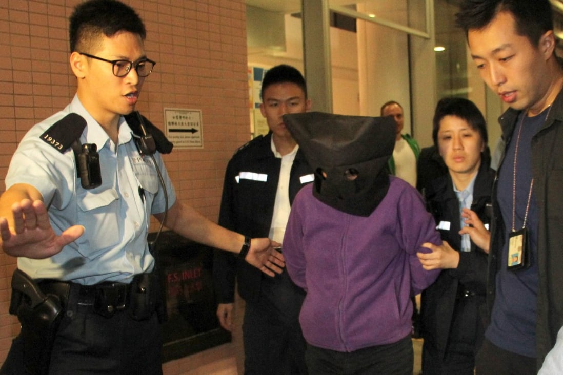 Police officers arrest Kan Kwai-fong. Photo: Handout